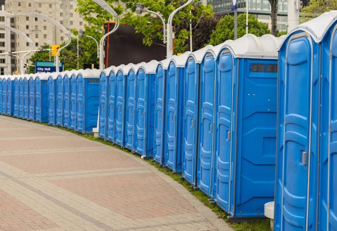 hygienic portable restrooms lined up at a beach party, ensuring guests have access to the necessary facilities while enjoying the sun and sand in Hatton